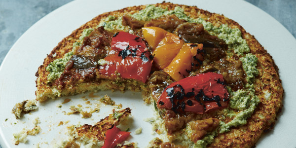 Cauliflower pizza with roasted vegetables and pesto