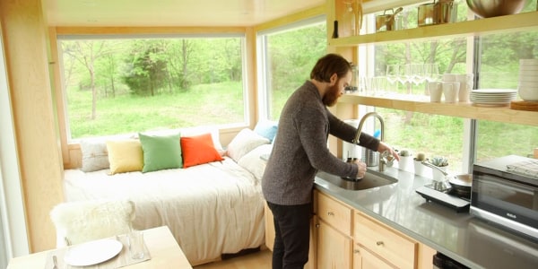 Take a tour of this 180-square-foot glass-paneled tiny house