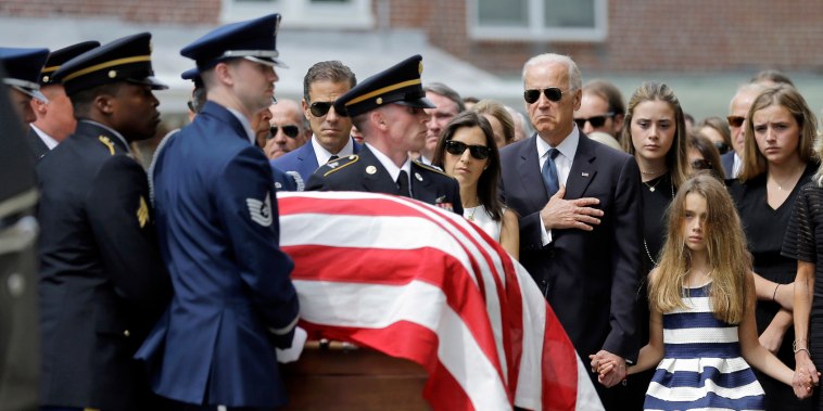Vice President Joe Biden holds his hand over his heart as he watches an honor guard carry a casket containing the remains of his son, Beau Biden, in Wilmington, Del. on June 6, 2015. (Photo by Patrick Semansky/AP)