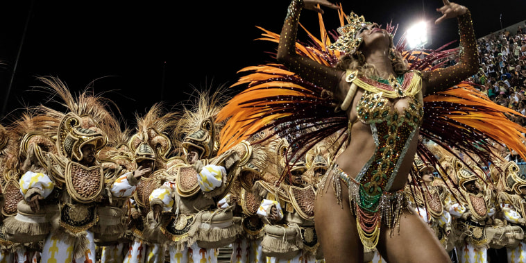Image: Revelers of Unidos da Tijuca samba school perform during the first night of the carnival parade