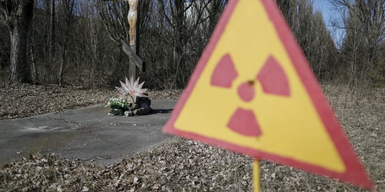 Image: A cross with a crucifix is seen in the deserted town of Pripyat near Chernobyl Nuclear Power Plant in Ukraine