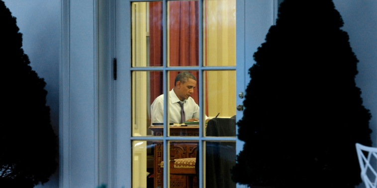Image: President Barack Obama works on a draft of his State of the Union address