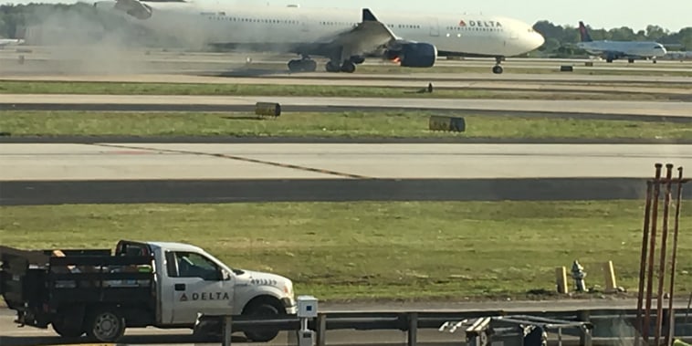 Image: Delta Airlines flight 30 on fire after landing safely.