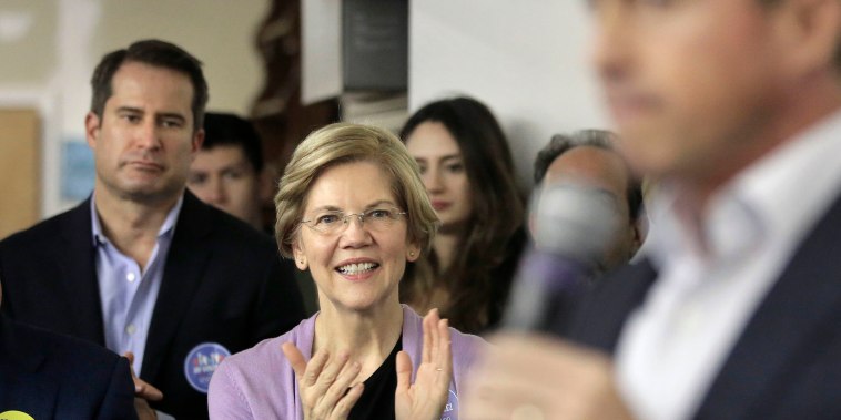 Image: Democrat U.S. Sen. Elizabeth Warren, center, applauds as Massachusetts gubernatorial candidate Jay Gonzalez addresses a crowd during a campaign stop