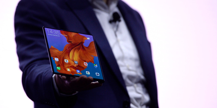 Image: Richard Yu, the CEO of Huawei's consumer products division, holds the Mate X foldable smartphone at the Mobile World Congress in Barcelona on Feb. 24, 2019.