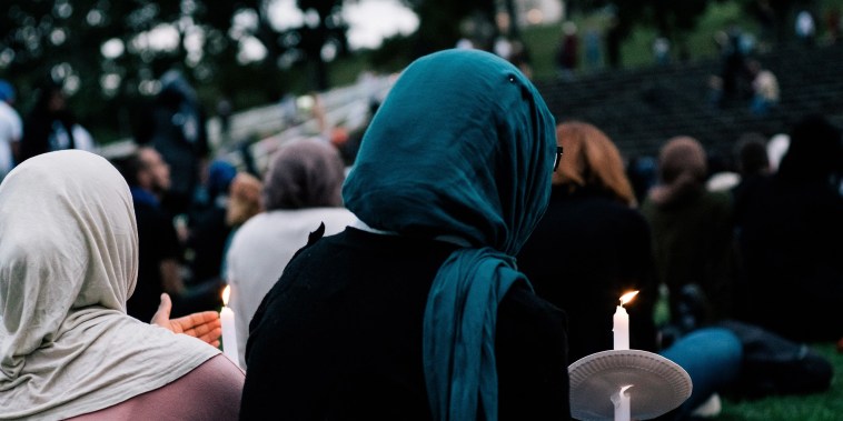 Image: People attend a vigil for the lives taken in the Christchurch terror attacks at the Auckland Domain on March 22, 2019 in Auckland