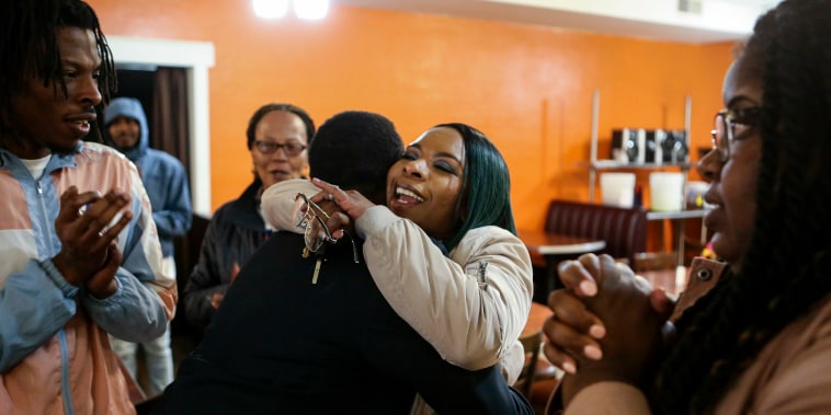 Image: Michael Brown's mother Lesley McSpadden embraces her brother Courtney McSpadden during McSpadden's election night watch party after losing the Ferguson City Council race at Sweetie Pie's in Dellwood
