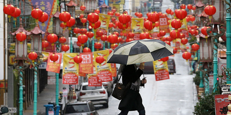 Image: Woman carries umbrella in San Franisco, Chinatown