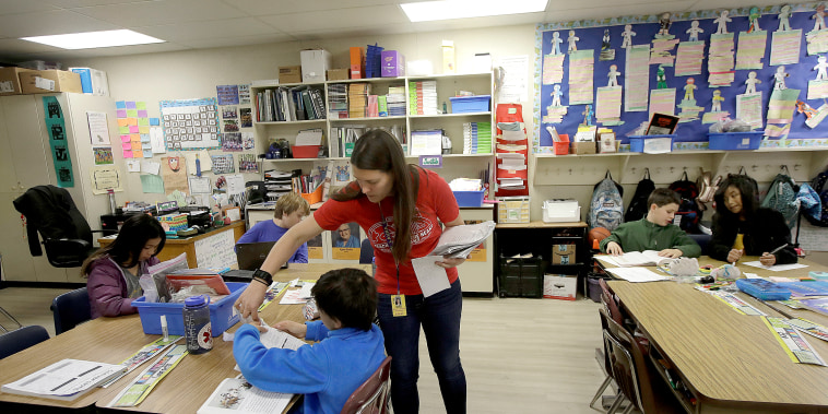 Laura Shield, a fourth grade teacher at Chabot Elementary School in Oakland, California, with a student in March.
