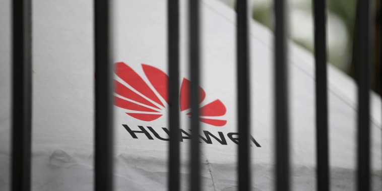 Image: A Huawei logo through fence at its headquarters in Shenzhen, Guangdong province, China