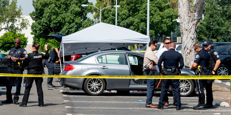 Image: Police investigate the scene where a Cal State Fullerton administrator was fatally stabbed in Fullerton, Calif., on Aug. 19, 2019.