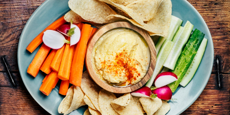 Hummus with vegetables and tortilla chips