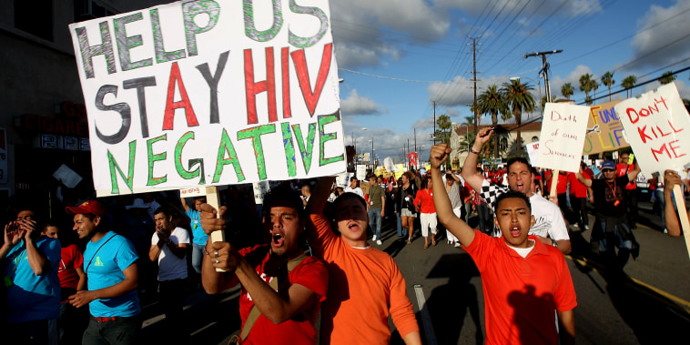 Image: Supporters and AIDS patients march to protests budget cuts to life-saving AIDS services in California on June 5, 2009.
