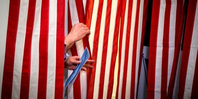 Image: Joe Casey exits a voting booth at the first-in-the-nation midnight voting tradition at Dixville Notch, N.H., on Feb. 11, 2020.