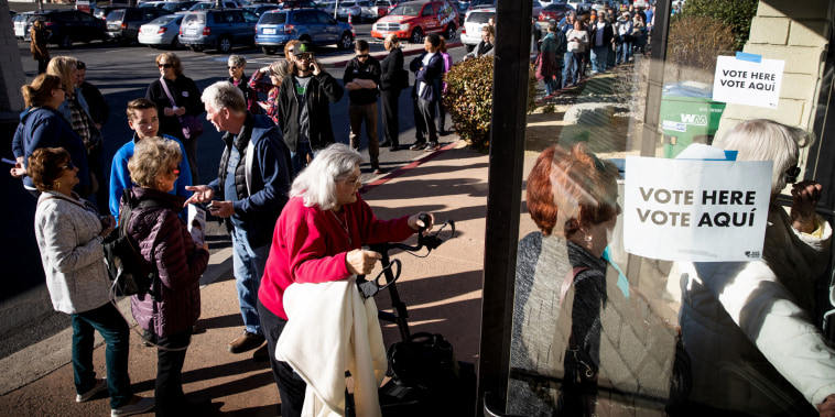 Image: Voters arrive to vote early in the Nevada caucuses in Reno on Feb. 18, 2020.