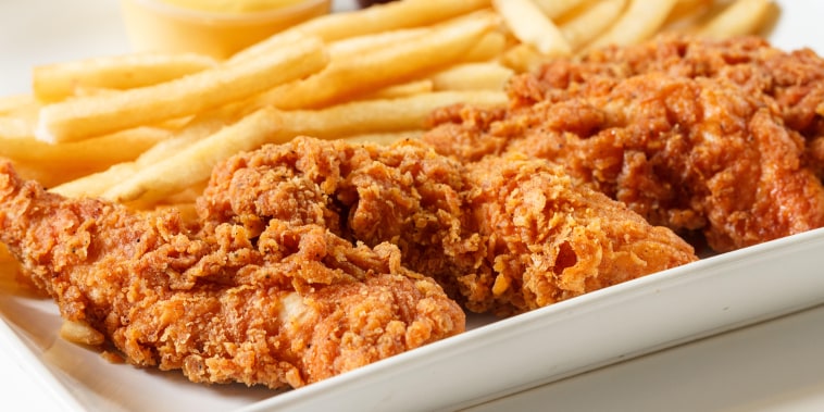 fried chicken fingers with french fries and dipping sauce