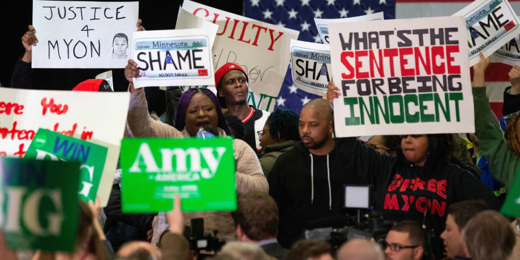 Image: Protesters take over the stage forcing Democratic presidential hopeful Minnesota Senator Amy Klobuchar to cancel her rally before it even started