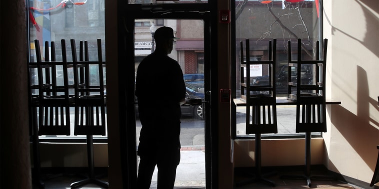 Owner and chef Anthony Caldwell looks out from 50Kitchen in the Field's Corner neighborhood of Boston on March 18, 2020.