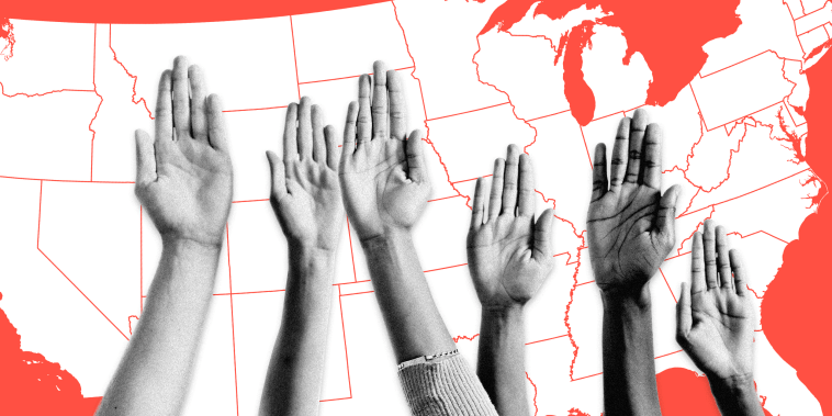 Image: A group of raised hands in front of a United States map.