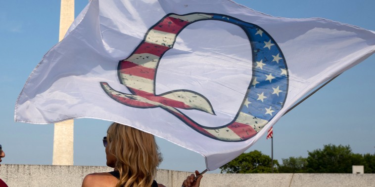 Image: QAnon supporters wait for the military fly