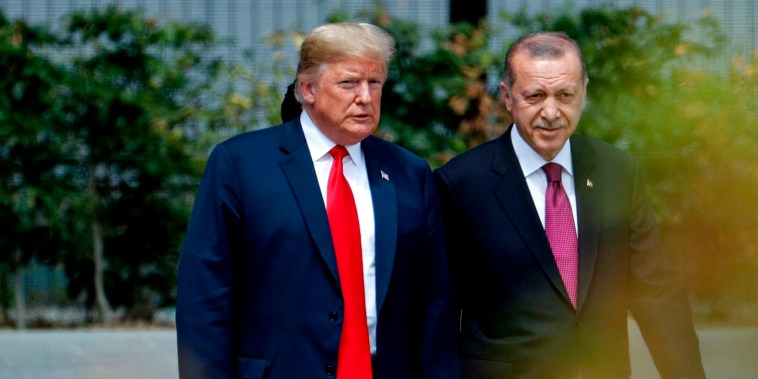Image: President Donald Trump and Turkish President Recep Tayyip Erdogan at the opening ceremony of the NATO Summit in Brussels on July 11, 2018.
