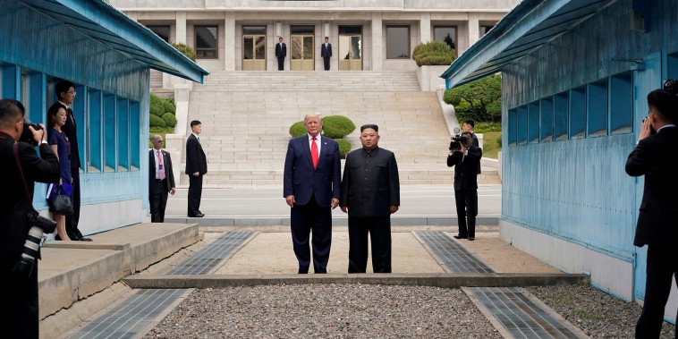 Image: President Donald Trump and North Korean leader Kim Jong Un stand at the demarcation line in the demilitarized zone separating the two Koreas, in Panmunjom, South Korea,