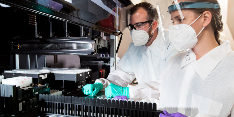 Senior proteomics scientist Matthew Meyer and research associate Stephanie Knapik work in a lab that analyzes blood samples at the C2N Diagnostics' facility in St. Louis on July 22, 2020.