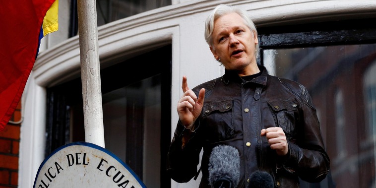 Image:  WikiLeaks founder Julian Assange speaks on the balcony of the Ecuadorian Embassy in London