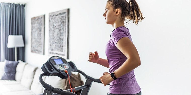 Woman running on her home treadmill