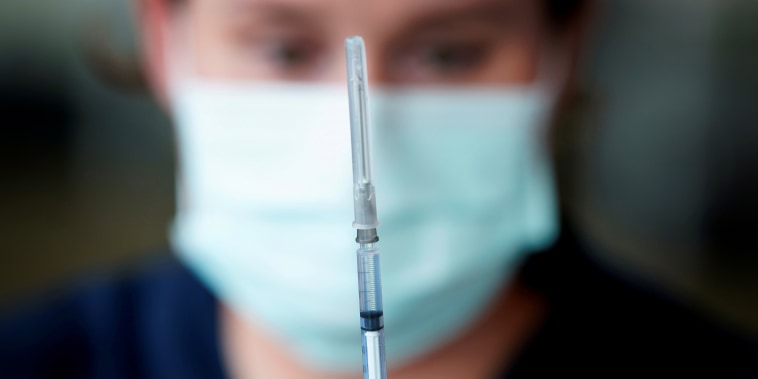 The Pfizer COVID-19 vaccine is prepared by a healthcare worker in Melbourne, Australia, February 22, 2021.