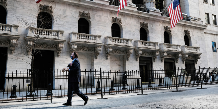 A pedestrian passes the New York Stock Exchange on Feb. 25, 2021 in New York.