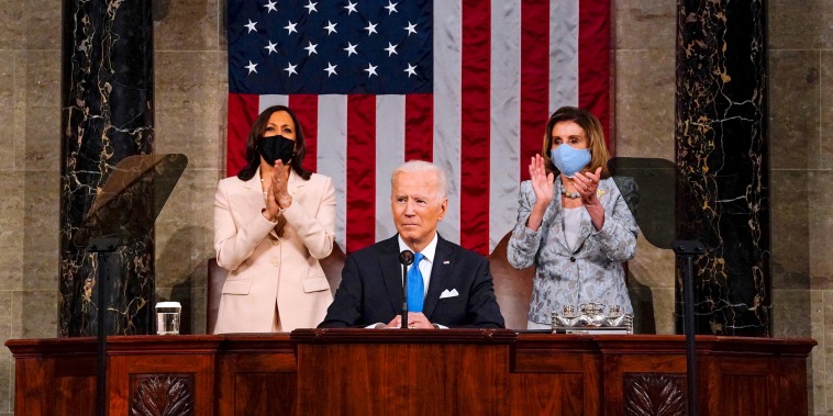 Image: Vice President Kamala Harris and Speaker of the House of Representatives Nancy Pelos applaud as President Joe Biden addresses a joint session of Congress at the U.S. Capitol on April 28, 2021.