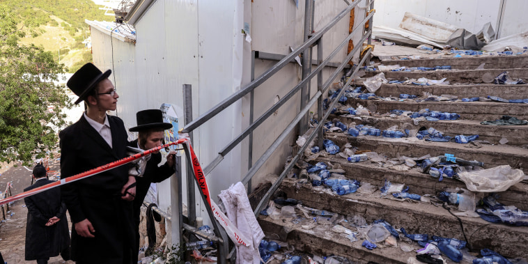 Image: Ultra Orthodox Jews look at stairs with waste on it in Mount Meron, northern Israel, where fatalities were reported among the thousands of ultra-Orthodox Jews gathered at the tomb of a 2nd-century sage for annual commemorations that include all-nig