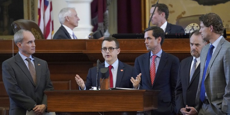 Image: Rep. Briscoe Cain, R-Houston, center, speaks in favor of HB 6, an election bill, in the House Chamber at the Texas Capitol in Austin, Tx.