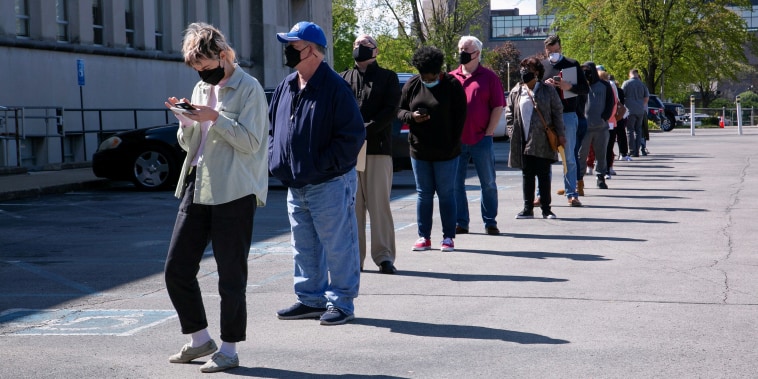 Image: People line up outside a newly reopened career center for in-person appointments in Louisville, Ky.