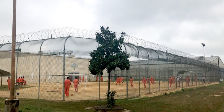 Image: Detained immigrants play soccer behind a barbed wire fence at the Irwin County Detention Center in Ocilla, Ga., on Feb. 20, 2018.