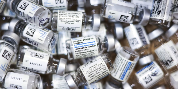 Used vials of the Johnson and Johnson Covid-19 vaccine sit in a box on March 6, 2021, in Thornton, Colo.