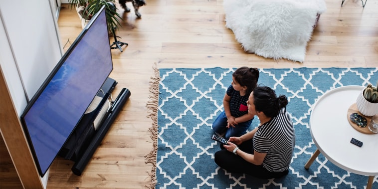 mother and daughter watching tv in living room. See the best TV brands to try in 2021. Shop top TV brands including the Samsung Q90A QLED TV, LG CX OLED TV, TCL Class 5 Series and more.
