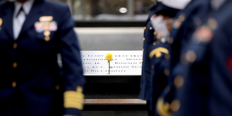 Members of the U.S. Coast Guard honor veterans killed in the attacks on September 11 at the memorial at Ground Zero on Veterans Day on Nov. 11, 2020 in New York.