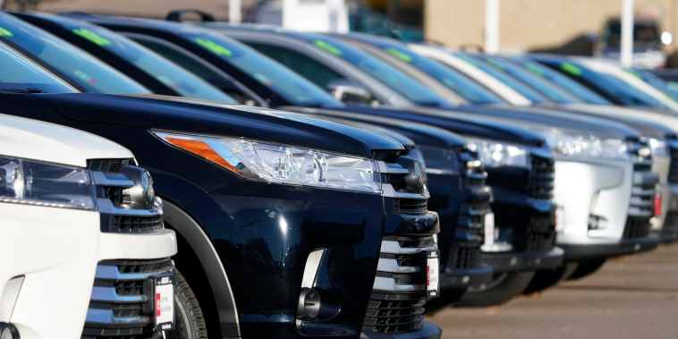 A long row of unsold used Highlander sports-utility vehicles sits at a Toyota dealership in Englewood, Colo., on Nov. 15, 2020.