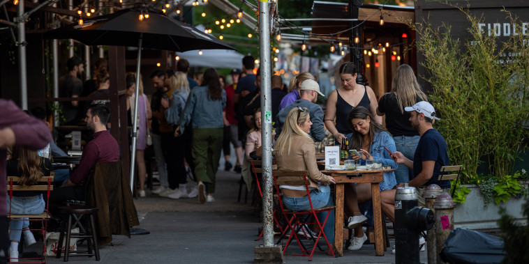 Image: Customers dine outdoors at Fiddlesticks Bar on Memorial Day on May 31, 2021 in New York City.