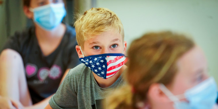 Fifth graders wear masks during a music class at the Milton Elementary School, on May 18, 2021, in Rye, N.Y.