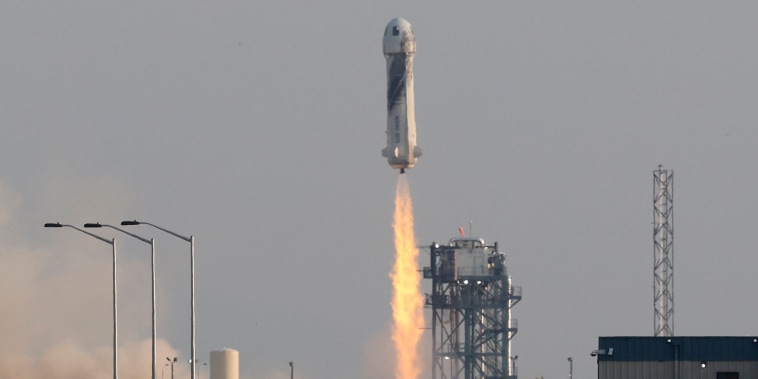 Image: Billionaire businessman Jeff Bezos is launched with three crew members aboard Blue Origin's New Shepard rocket
