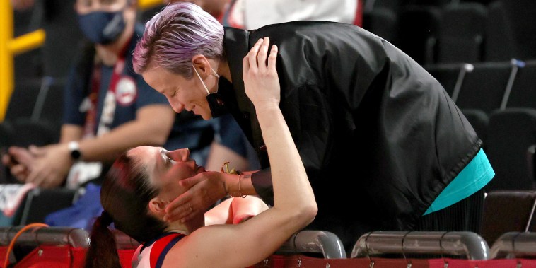 Megan Rapinoe congratulates Sue Bird #6 of Team United States after the United States' win over Japan in the Women's Basketball final game on day sixteen of the 2020 Tokyo Olympic games at Saitama Super Arena on August 08, 2021.