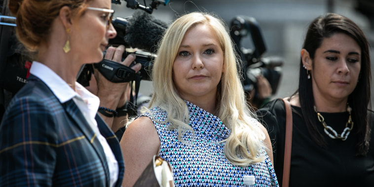 Virginia Giuffre, an alleged victim of Jeffrey Epstein, center, exits from federal court in New York on Aug. 27, 2019.