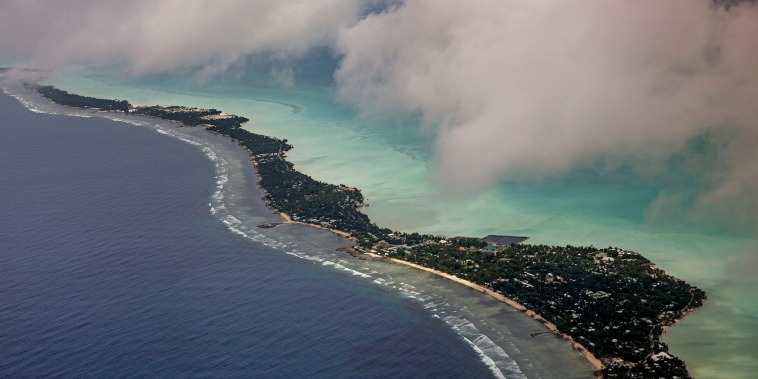 Image: The people of Kiribati are under pressure to relocate due to sea level rise. Each year, the sea level rises by about half an inch