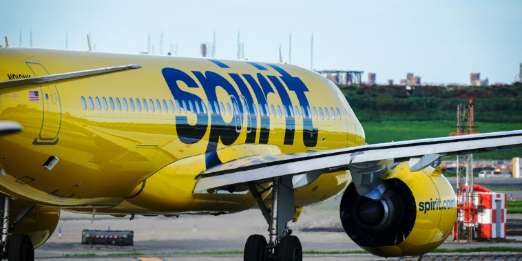 A Spirit Airlines aircraft takes off at La Guardia Airport