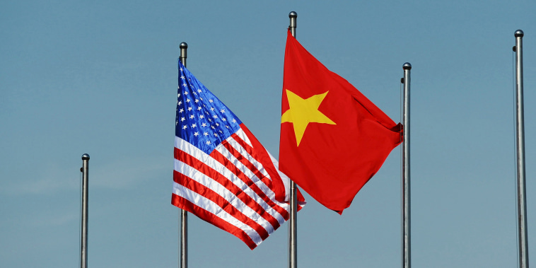 The U.S. flag flutters next to the Vietnamese flag in Hanoi, Vietnam, on June 1, 2015.