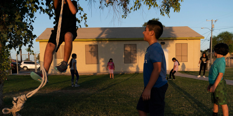 Image: Children play in the yard of a community boxing club Thursday, Aug. 19, 2021, in Somerton, Ariz.