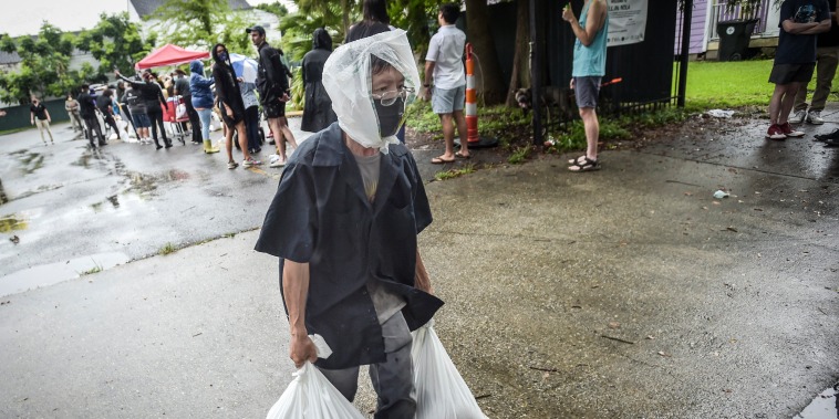 Image: A resident takes home sandbags from a city run sandbag distribution location at the Dryades YMCA along Oretha Castle Haley Blvd., on Aug. 27, 2021, in New Orleans, as residents prepare for Hurricane Ida.